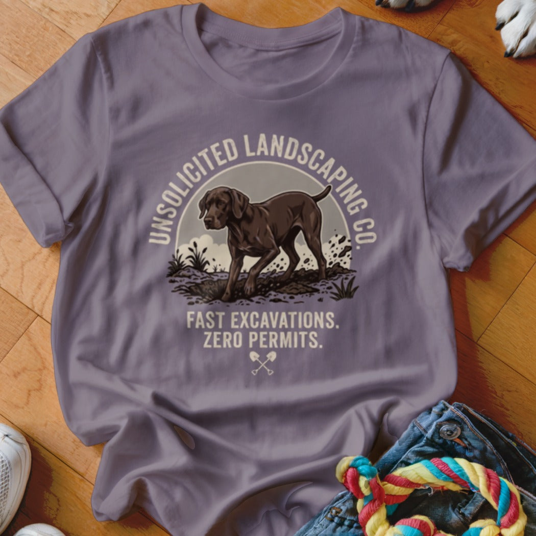 T-shirt graphic with dog and text "Unsolicited Landscaping Co. Fast Excavations. Zero Permits."