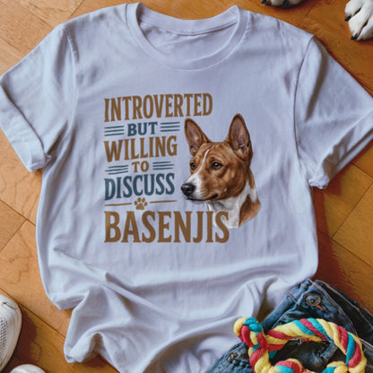 White t-shirt with "Introverted But Willing To Discuss Basenjis" text and dog portrait.