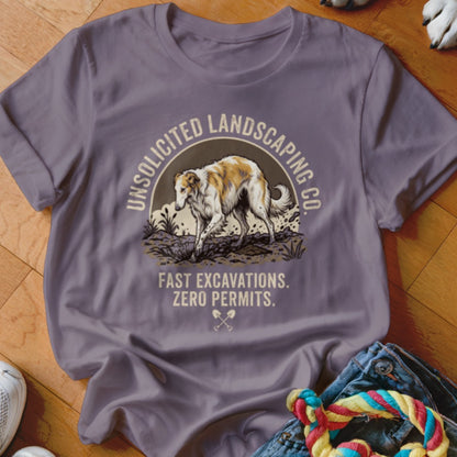 T-shirt with graphic of a Borzoi dog and text "Unsolicited Landscaping Co. Fast Excavations. Zero Permits."