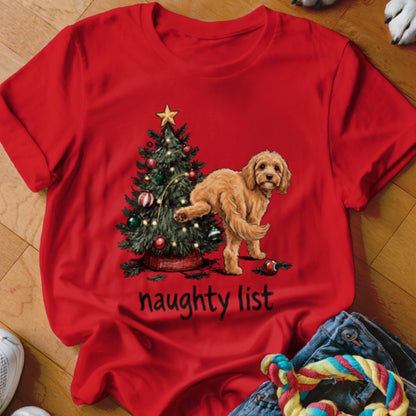 Red t-shirt with a dog next to a Christmas tree and the text "naughty list".