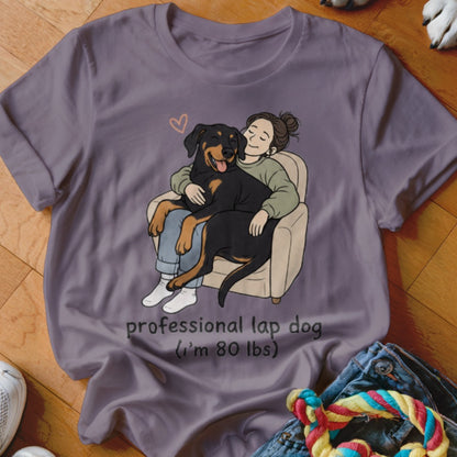 T-shirt graphic of a person hugging a Rottweiler with text "professional lap dog (i'm 80 lbs)".