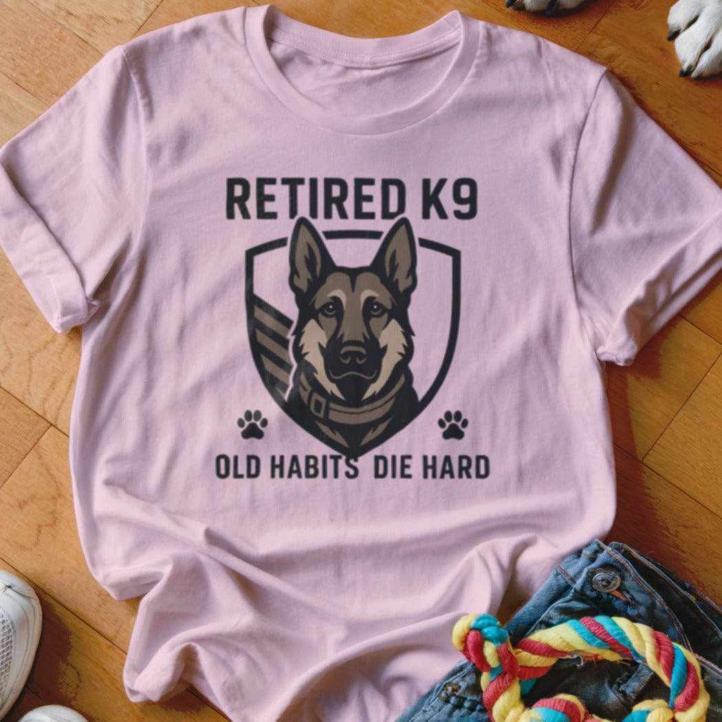 Pink t-shirt with a German Shepherd graphic and text "RETIRED K9 OLD HABITS DIE HARD".