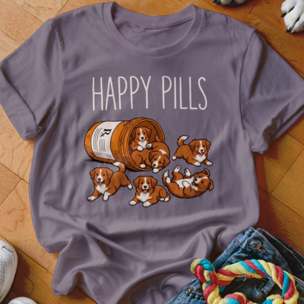 T-shirt with illustration of playful puppies spilling from a pill bottle with text "Happy Pills".
