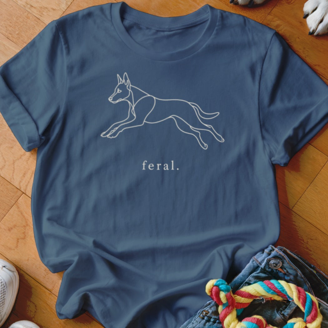 Blue t-shirt with a white line drawing of a dog in mid-leap and the word "feral."