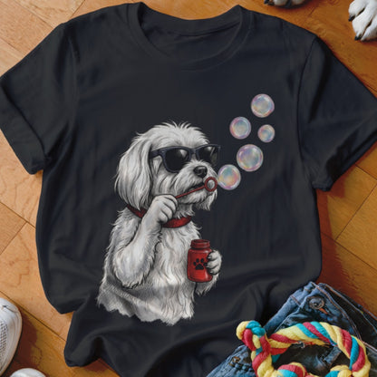 A black t-shirt printed with a graphic of a white dog wearing sunglasses and blowing bubbles.