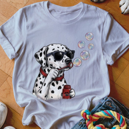 A white t-shirt features a graphic of a dalmatian wearing sunglasses while blowing soap bubbles.