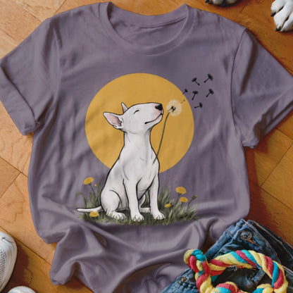 A purple crewneck t-shirt featuring an illustration of a white bull terrier blowing dandelion seeds.