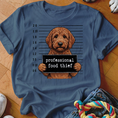 Goldendoodle with "professional food thief" sign in mugshot style.