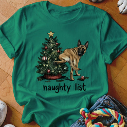 Green t-shirt with a dog lifting its leg on a Christmas tree and the text "naughty list".