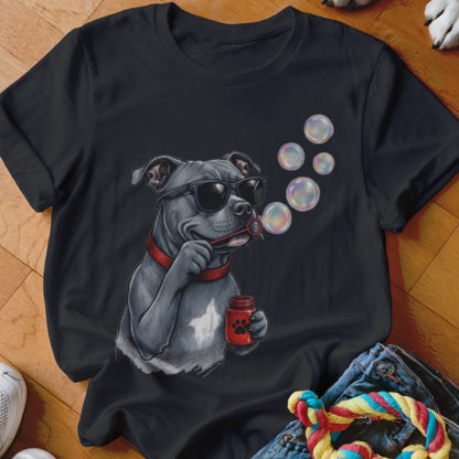 A black t-shirt features a graphic of a grey dog wearing sunglasses and blowing bubbles.