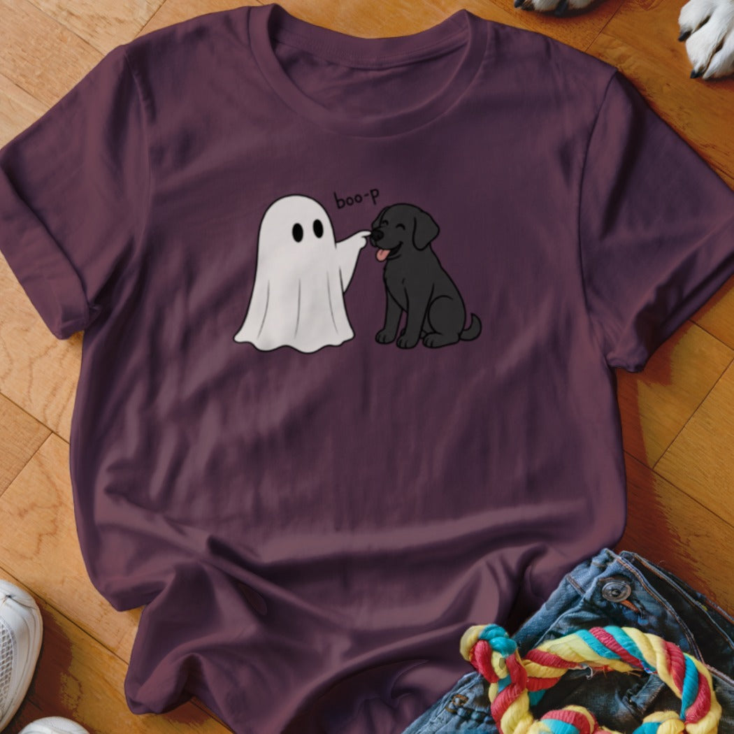 Ghost costume touching nose of black dog with "boo-p" text on plum t-shirt.