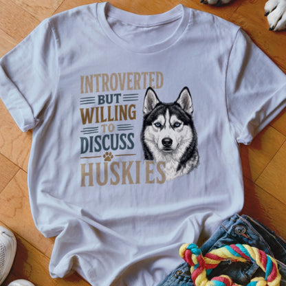 White t-shirt with "Introverted But Willing to Discuss Huskies" text and husky graphic.