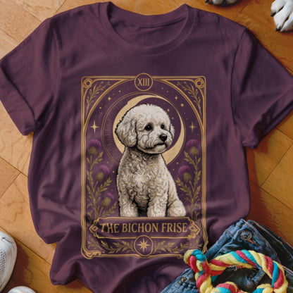 A dark purple t-shirt featuring a tarot card graphic of a Bichon Frise with the text "The Bichon Frise".