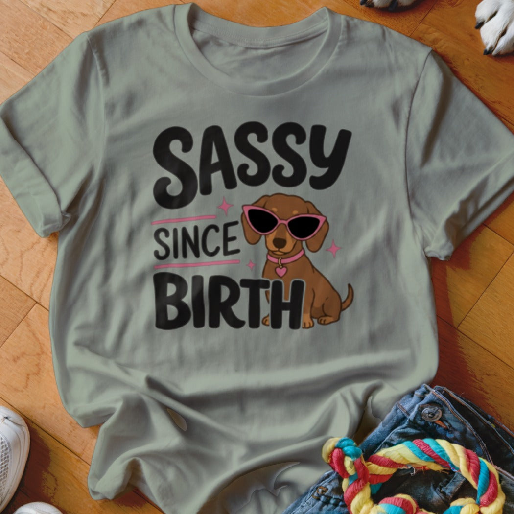 Light grey t-shirt with dachshund wearing sunglasses and text "SASSY SINCE BIRTH".