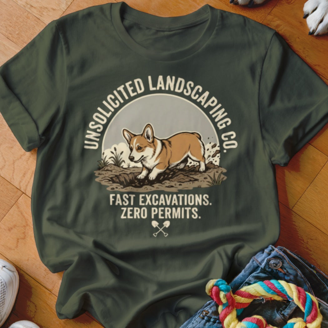 Olive green t-shirt with a corgi digging in dirt and "Unsolicited Landscaping Co." text.