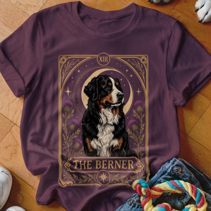 Maroon t-shirt featuring a tarot card graphic of a Bernese Mountain Dog with the text THE BERNER.