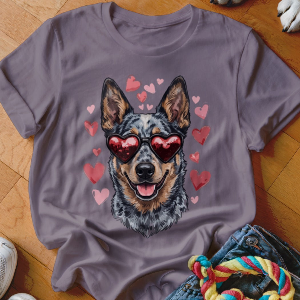 Gray t-shirt featuring a graphic of an Australian Cattle Dog wearing heart-shaped sunglasses surrounded by floating pink hearts.