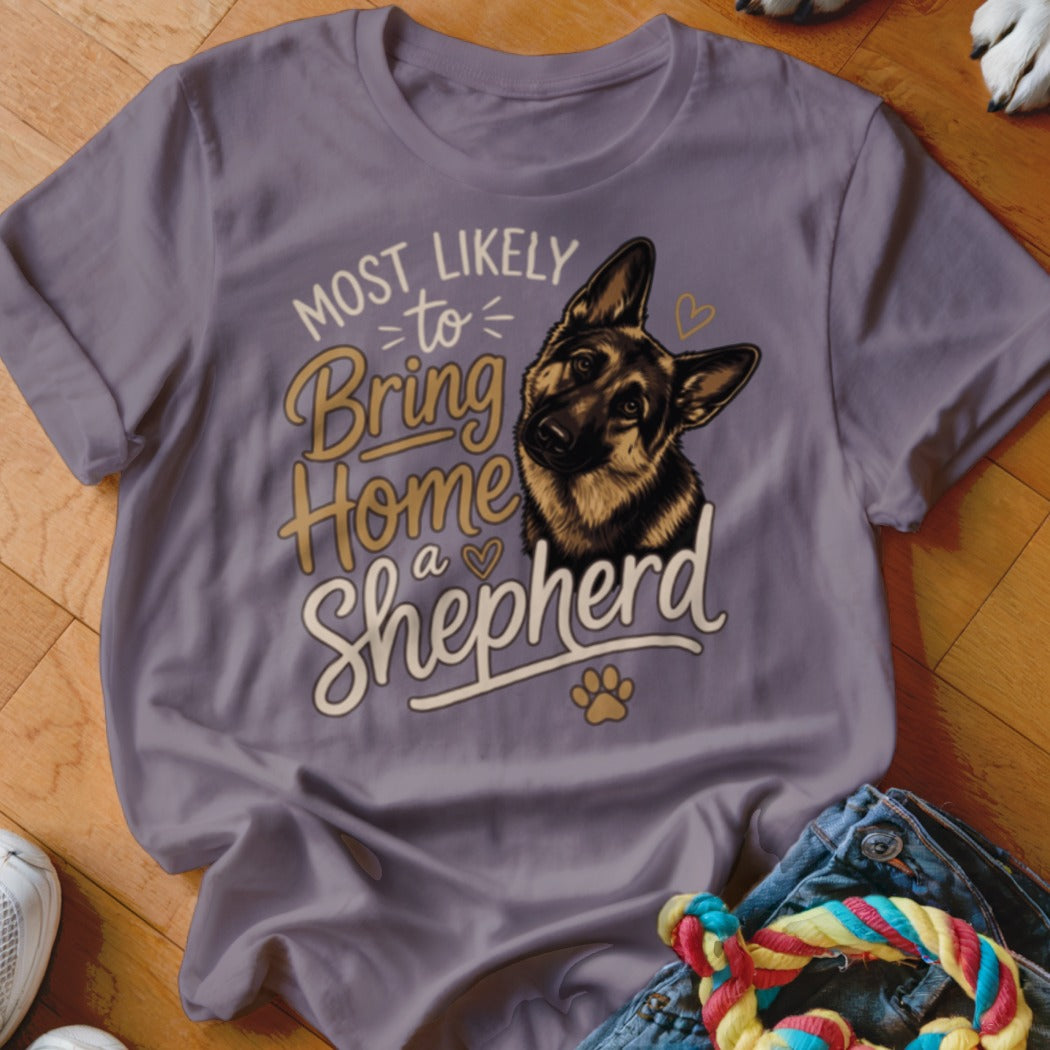 German Shepherd graphic t-shirt with "Most Likely to Bring Home a Shepherd" text.