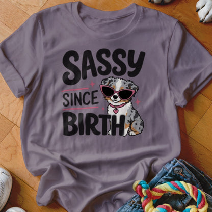 Purple t-shirt with "SASSY SINCE BIRTH" text and a cartoon dog wearing sunglasses.