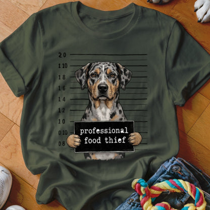 Catahoula dog mugshot with text "professional food thief" on dark green shirt.