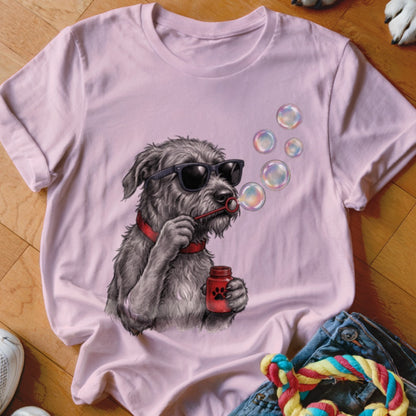 A light pink t-shirt featuring a graphic of a scruffy dog blowing bubbles.
