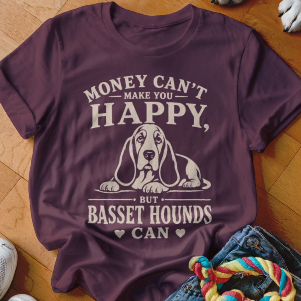 Maroon t-shirt with white text and a Basset Hound graphic. Text reads "Money can't make you happy, but Basset Hounds can."