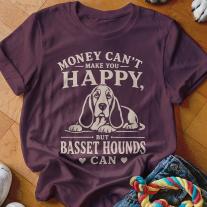 Maroon t-shirt with white text and a Basset Hound graphic. Text reads "Money can't make you happy, but Basset Hounds can."