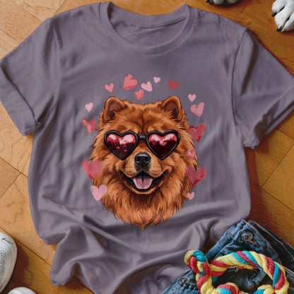 Gray t-shirt featuring a fluffy brown Chow Chow dog wearing heart-shaped sunglasses surrounded by pink hearts.