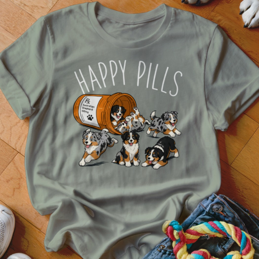 Happy Pills text with Australian Shepherd puppies spilling from a prescription bottle.