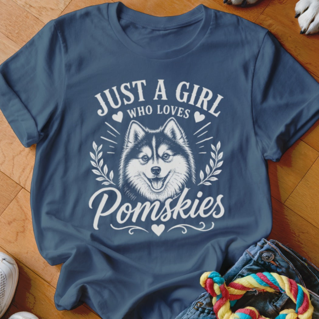 Blue t-shirt with "Just A Girl Who Loves Pomskies" and a dog graphic.