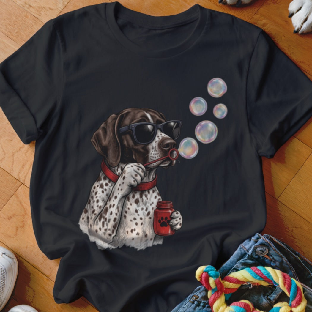 A black t-shirt features a graphic of a spotted dog wearing sunglasses and blowing colorful bubbles.