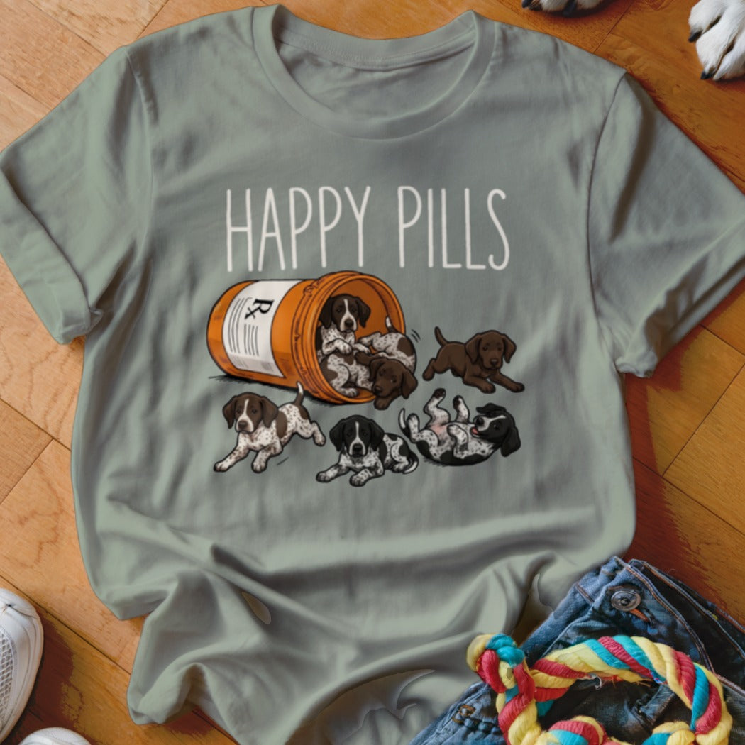 T-shirt with "HAPPY PILLS" text and puppies spilling out of a prescription bottle.