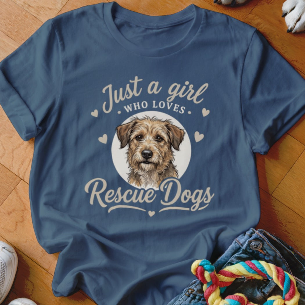 A blue t-shirt printed with a terrier illustration and text reading Just a girl who loves Rescue Dogs.