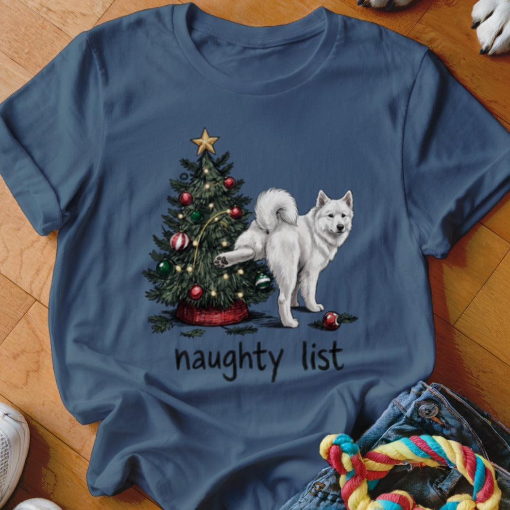 A slate blue t-shirt features a white dog lifting its leg on a Christmas tree above the text "naughty list".
