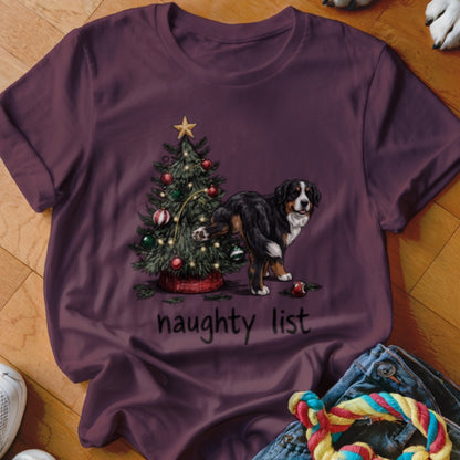 Bernese Mountain Dog near Christmas tree with "naughty list" text.
