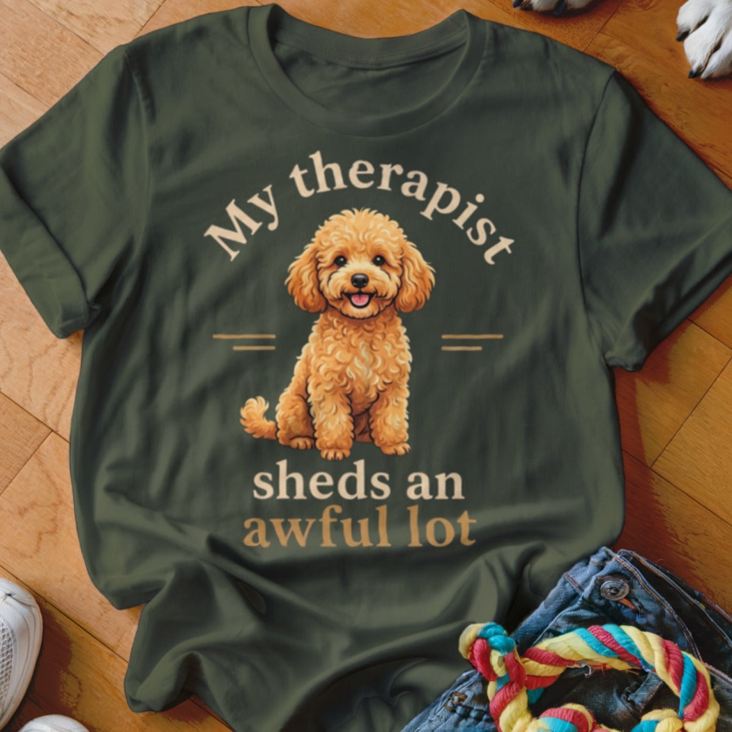 Dark green t-shirt with a poodle graphic and text "My therapist sheds an awful lot".