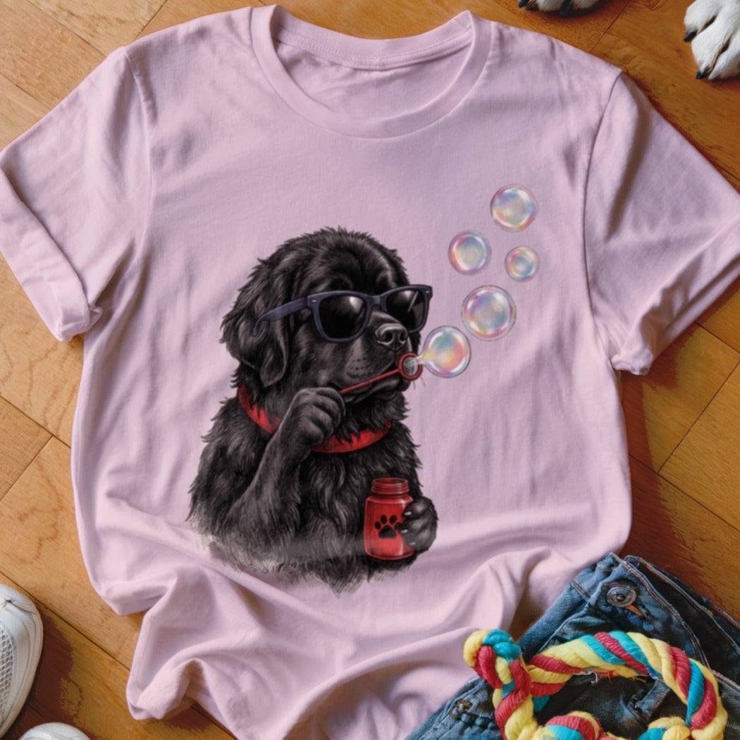 Light pink t-shirt featuring a graphic of a black dog wearing sunglasses and blowing bubbles.