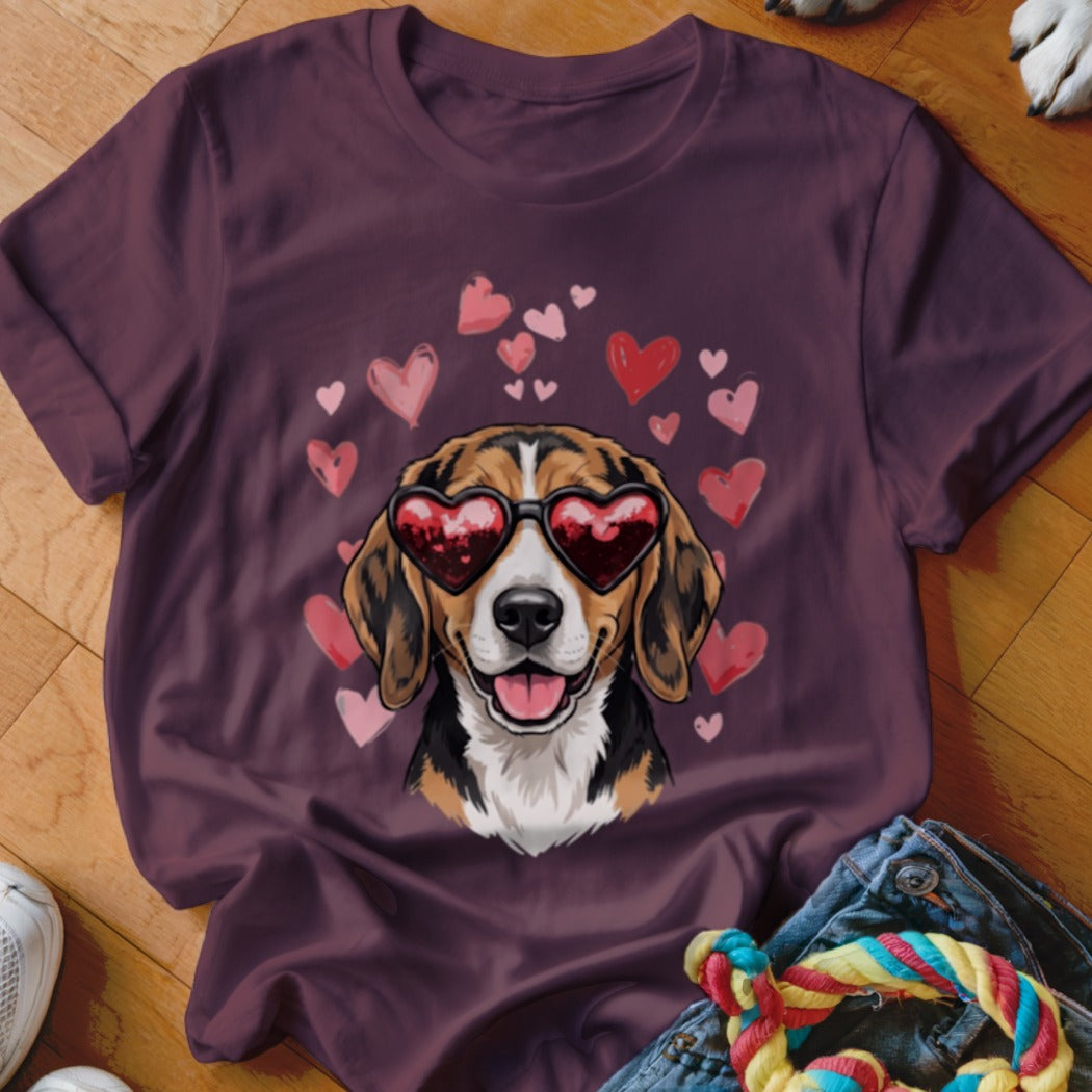 Maroon t-shirt featuring an illustrated beagle wearing heart-shaped sunglasses surrounded by pink and red hearts.