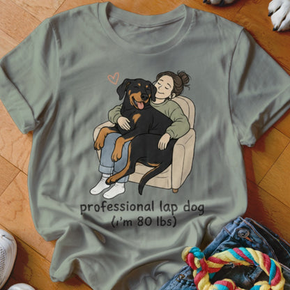 Illustration of a person hugging a large dog in a chair, with text "professional lap dog (I'm 80 lbs)".