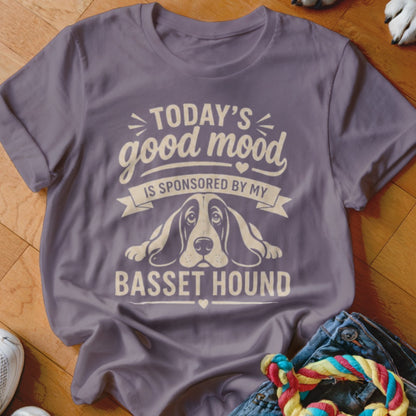 Purple t-shirt with text "Today's good mood is sponsored by my Basset Hound" and dog illustration.