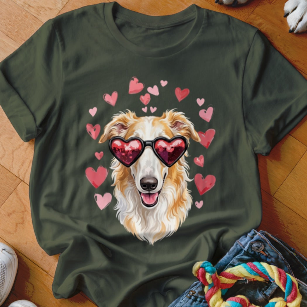 Dark green t-shirt featuring a graphic of a long-haired dog wearing heart-shaped sunglasses surrounded by pink hearts.