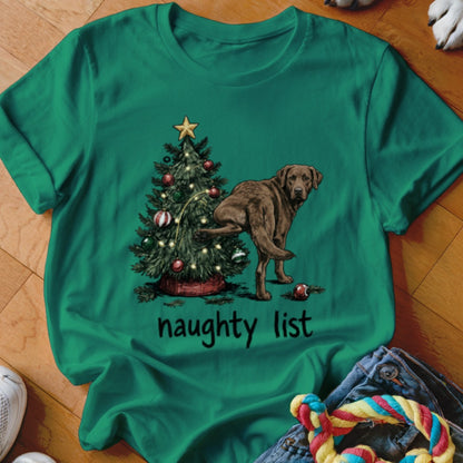Brown dog peeing on a Christmas tree, text says "naughty list".