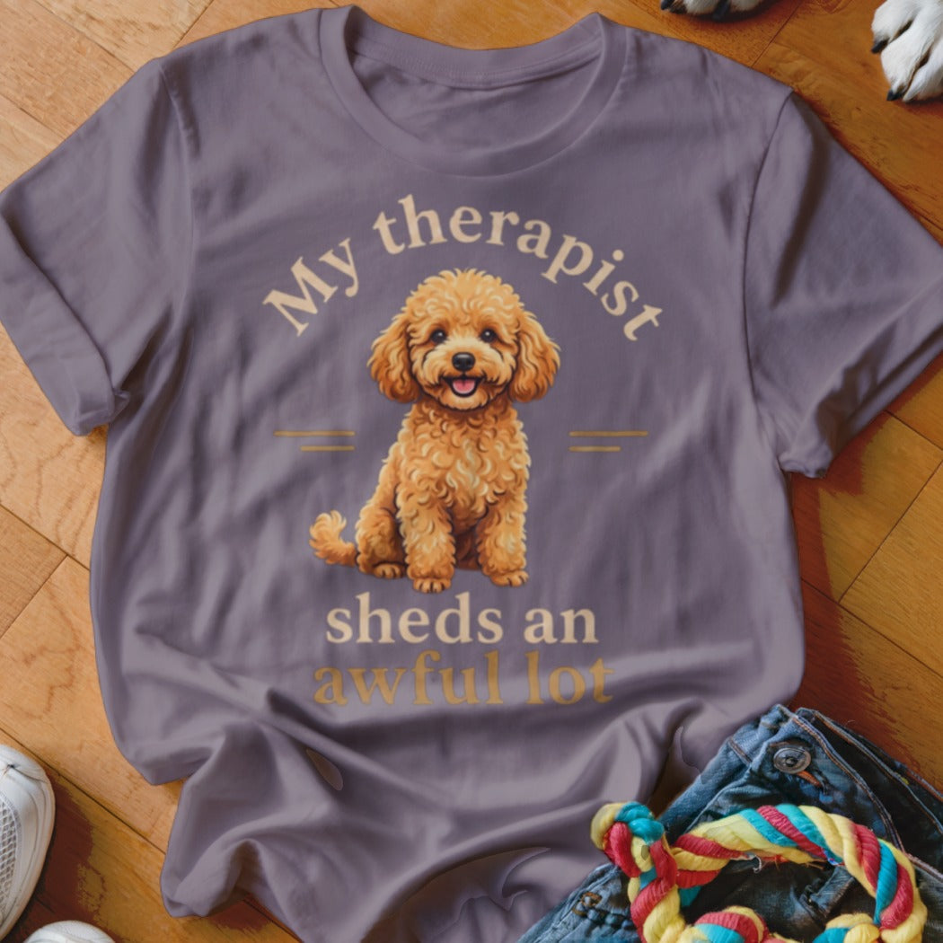 T-shirt with a poodle graphic and text "My therapist sheds an awful lot".