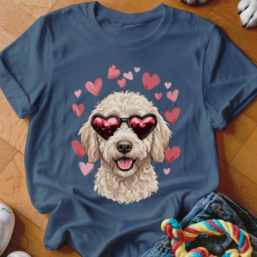 Navy blue t-shirt featuring a graphic of a fluffy golden doodle wearing heart-shaped sunglasses surrounded by pink hearts.
