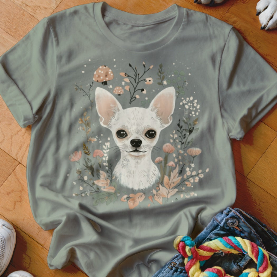 White chihuahua portrait surrounded by floral and mushroom illustrations on a grey t-shirt.