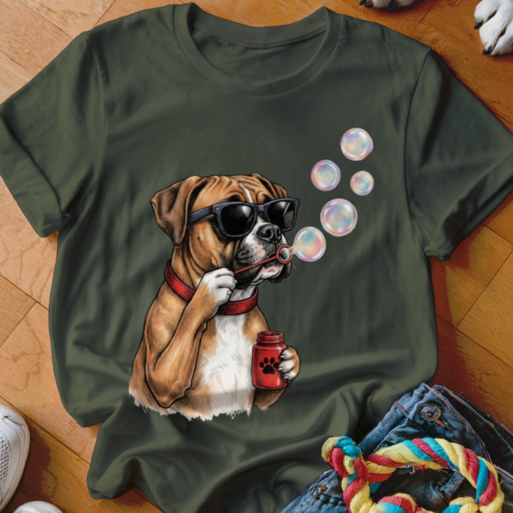 A dark green t-shirt featuring an illustration of a Boxer dog wearing sunglasses and blowing bubbles.