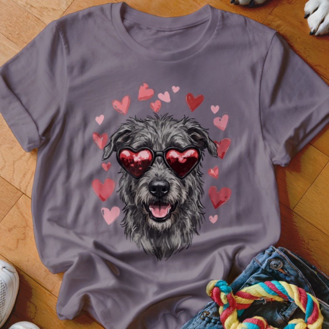 Purple t-shirt featuring a scruffy grey dog wearing heart-shaped sunglasses surrounded by pink and red hearts.