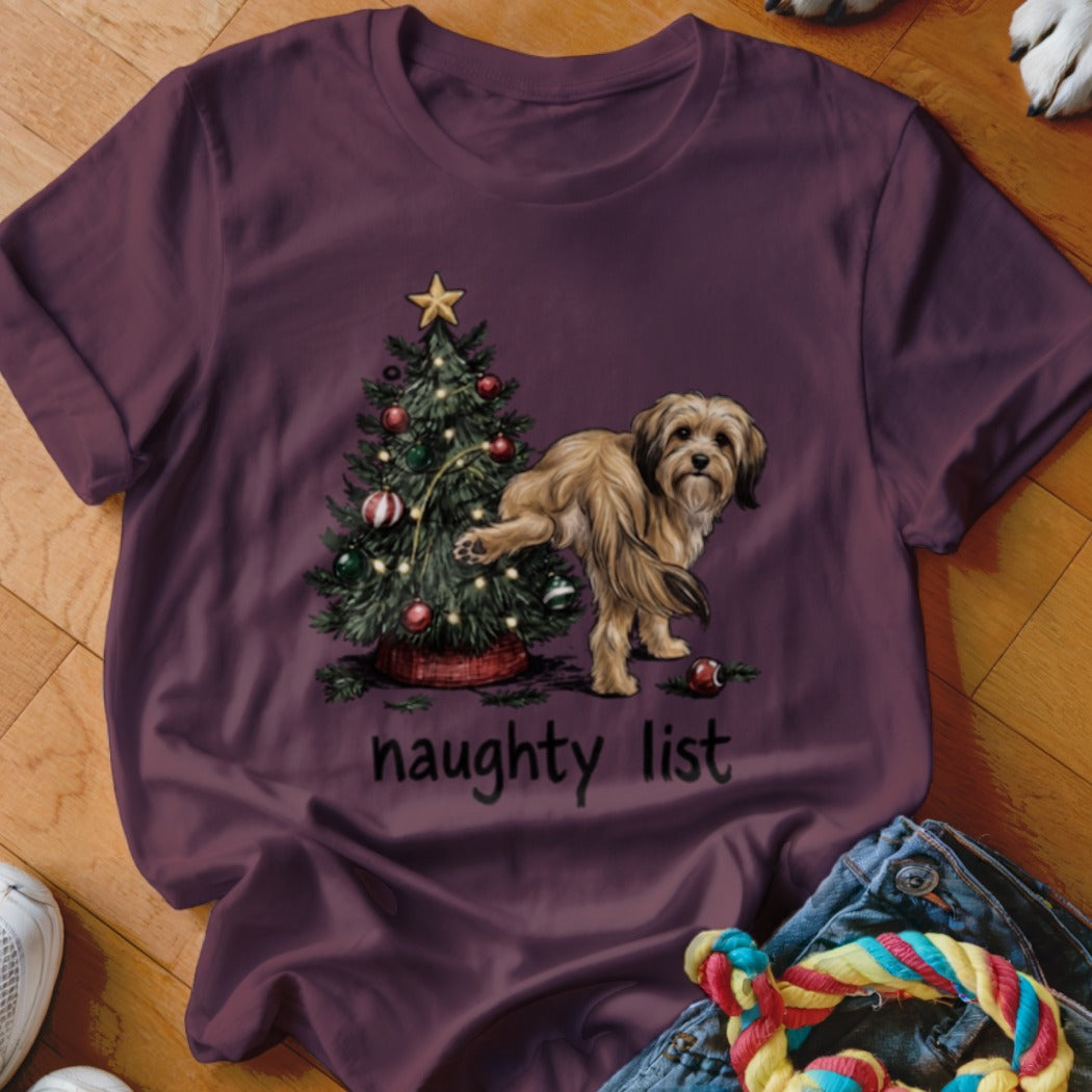 Maroon t-shirt with a dog next to a Christmas tree, text reads "naughty list".