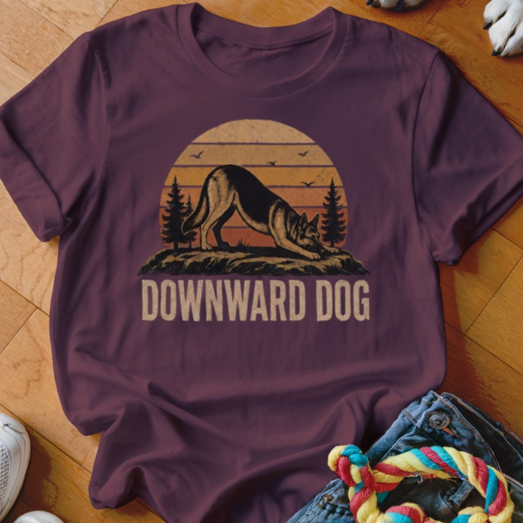 Maroon t-shirt with "DOWNWARD DOG" text and dog silhouette at sunset.