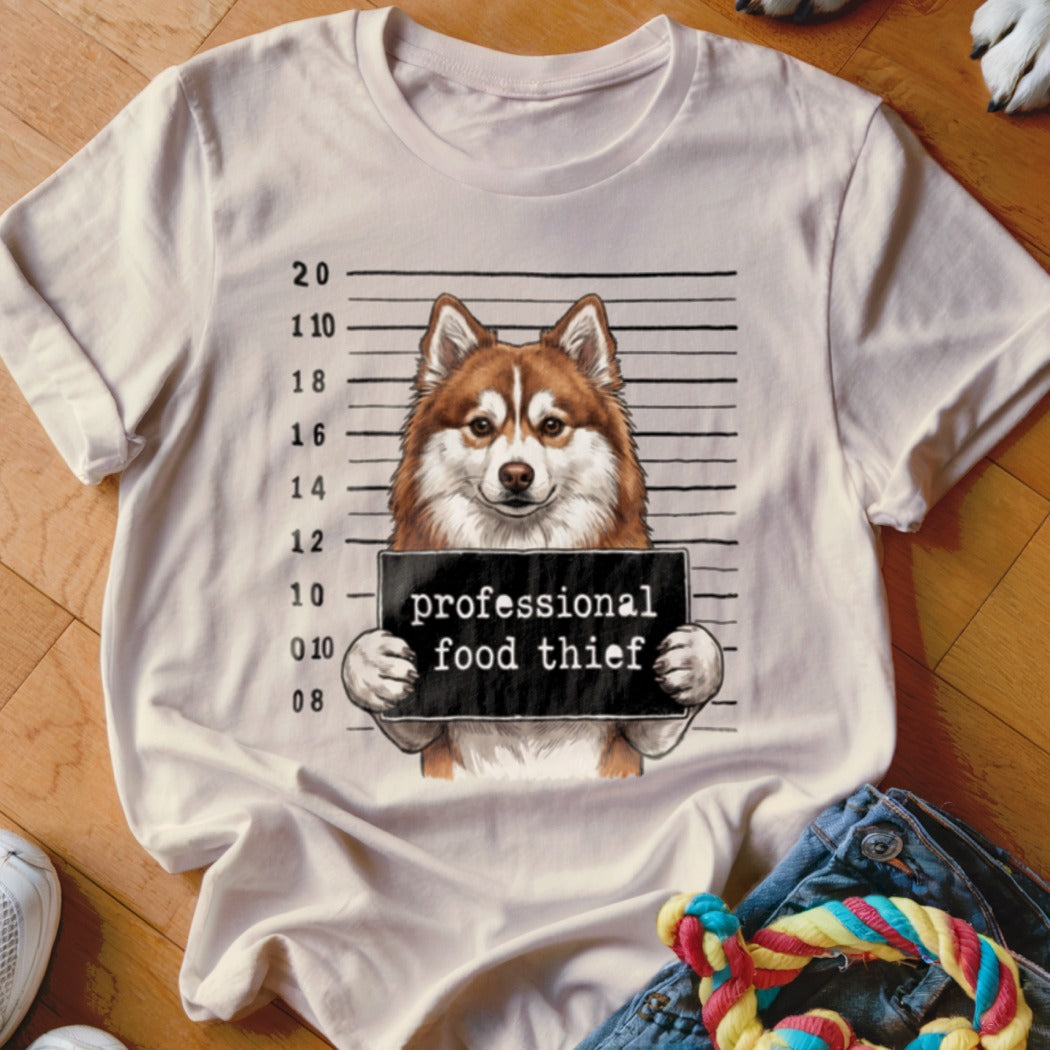 Husky mugshot graphic with text "professional food thief" on t-shirt.